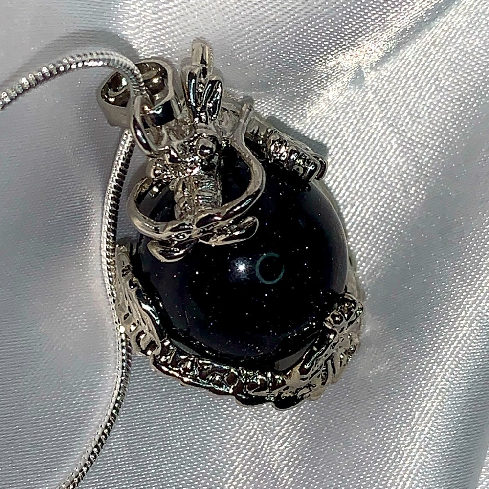 Star Stone dragon ball in a chain necklace.